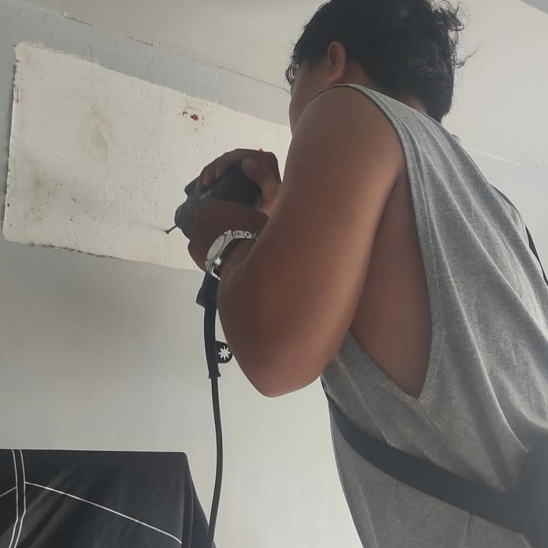 Technician performing general aircon cleaning